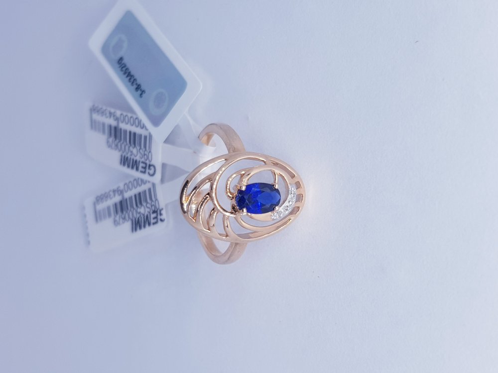 Gold ring with diamond and sapphire
